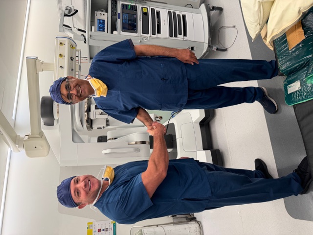 Dr Kooner with Dr Ryan Nelson on completion of surgery